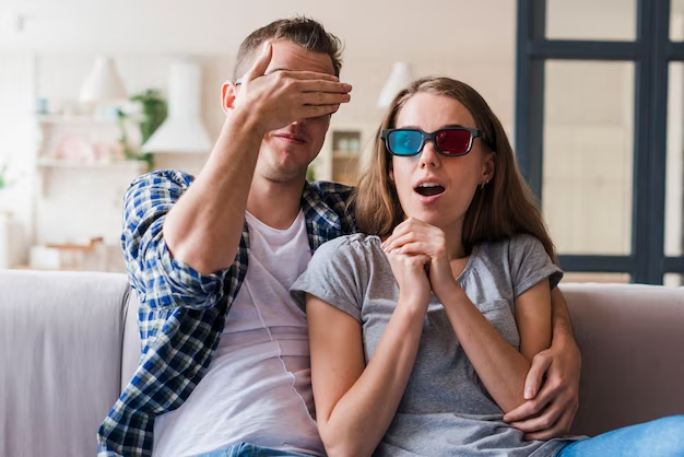 A man and a woman watching a movie