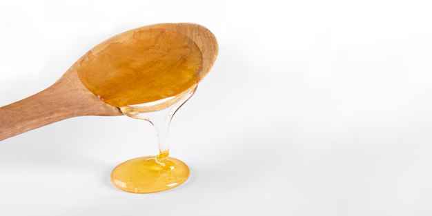 Wooden spoon with corn syrup